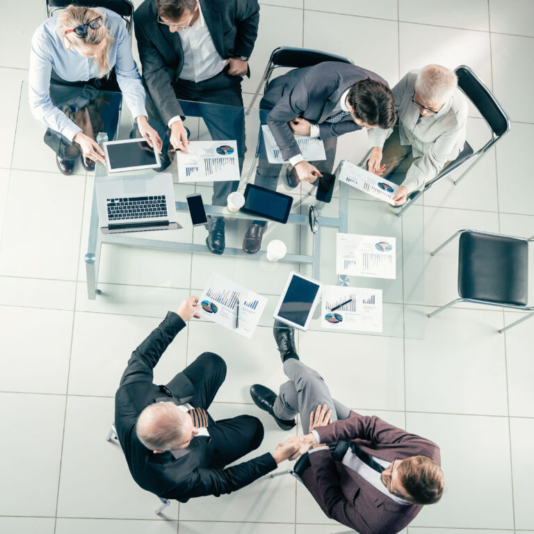top-view-working-group-analyzing-financial-statistics